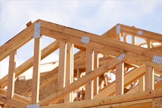 Abstract of wood home framing at construction site