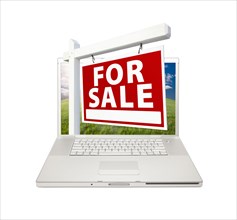 For sale real estate sign on computer laptop isolated on a white background
