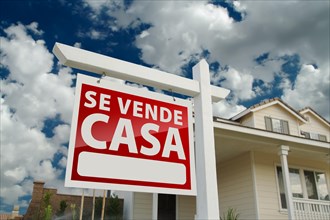 Red spanish home for real estate sale sign