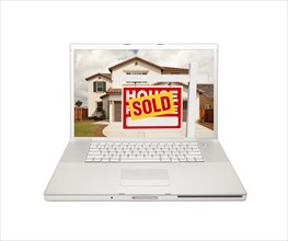 Sold for sale real estate sign on computer laptop isolated on a white background