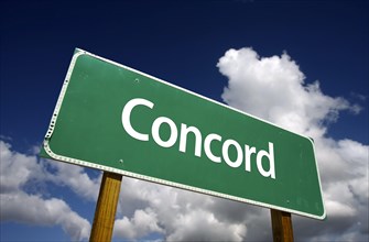Concord road sign with dramatic blue sky and clouds