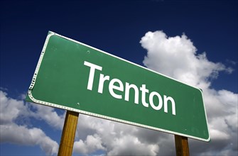 Trenton road sign with dramatic blue sky and clouds