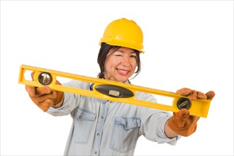 Hispanic female contractor holding level wearing hard hat isolated on white background