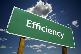Efficiency green road sign over dramatic blue sky and clouds with clipping path