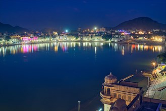 Night view of famous indian hinduism pilgrimage town sacred holy hindu religious city Pushkar with Brahma temple
