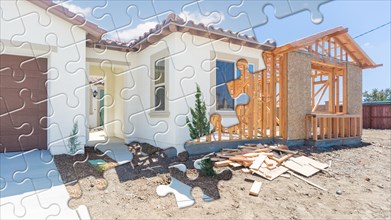 Puzzle pieces fitting together revealing finished house build over construction framing