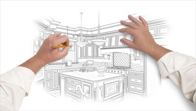 Male hands sketching with pencil the outline of a beautiful custom kitchen