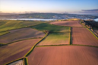 Devon Fields and Farmlands at sunset time from a drone over Shaldon and Teignmouth from Labrador Bay