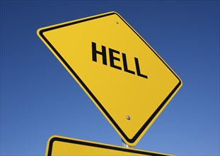 Hell yellow road sign against a deep blue sky with clipping path