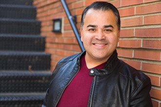 Headshot portrait of handsom hispanic man