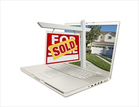 Red sold for sale sign on laptop isolated on a white background