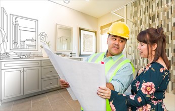 Hispanic male contractor talking with female client over blueprint plans in front of bathroom drawing gradating to photo