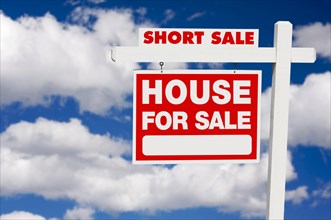 Short sale house for sale real estate sign on clouds