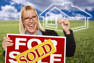Very happy woman with sold for sale real estate sign