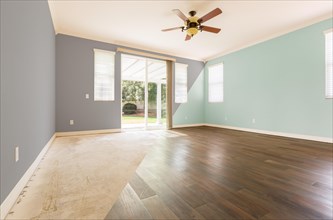 Empty room with cross section showing before and after with new wood floor and paint