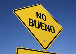 No bueno yellow road sign against a deep blue sky with clipping path