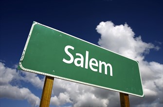 Salem road sign with dramatic blue sky and clouds