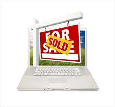 Sold for sale real estate sign on computer laptop isolated on a white background