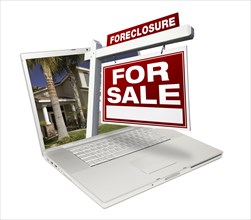Foreclosure home for sale real estate sign & laptop isolated on a white background