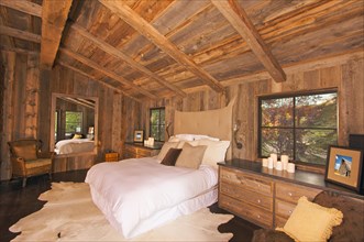 Luxurious rustic log cabin bedroom in a rural setting