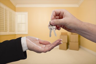 Handing over the house keys to A new home inside empty room