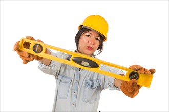 Hispanic female contractor holding level wearing hard hat isolated on white background