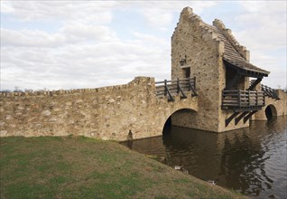 Ancient medieval replica bridge over river water