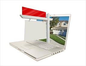 Blank real estate sign & new home on laptop isolated on a white background