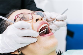 Female dentist checking a patient