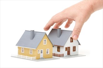 Male hand reaching for house isolated on a white background