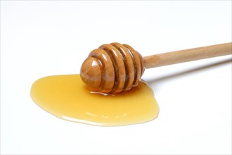 Bee honey with honey spoon