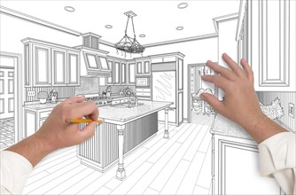 Male hands sketching with pencil the outline of a beautiful custom kitchen