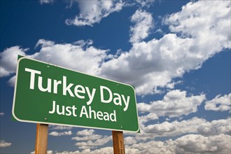 Turkey day green road sign with dramatic clouds and sky