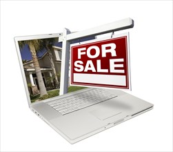 Home for sale sign & new home on laptop isolated on a white background