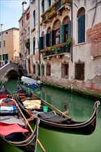 Two Docked Gondolas in Venice