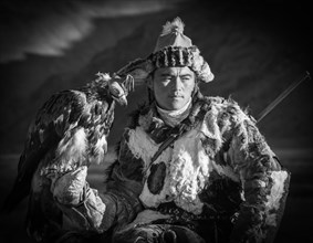 Young eagle hunter Yenisbek. Western Mongolia. Kazakh young man