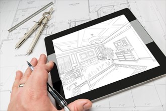 Hand of architect on computer tablet showing bedroom illustration over house plans