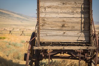 Abstract of vintage antique wood wagon in meadow