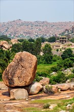 Giant boulder and ancient ruins in Hampi. Way to Vittala Temple. Sule Bazaar