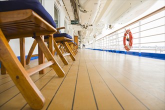 Abstract deck view of luxury passenger cruise ship and railing