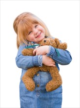 Cute little girl holding her teddy bear isolated on a white background