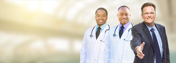 Caucasian businessman and african american male doctors