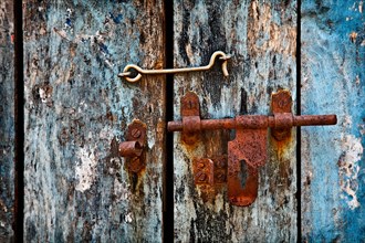 Old rusty latch on the door