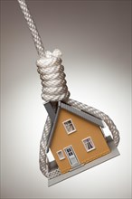 House tied up and hanging in hangman's noose