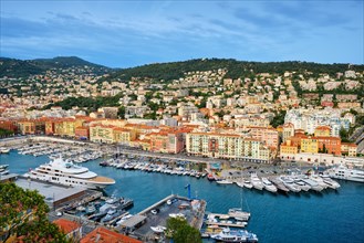 View of Old Port of Nice with luxury yacht boats from Castle Hill