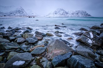 Waves and rocks on coast of Norwegian sea in fjord. Skagsanden beach