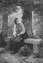 Young mother sitting on a bench