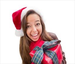 Girl wearing A christmas santa hat with bow wrapped gift iisolated on white