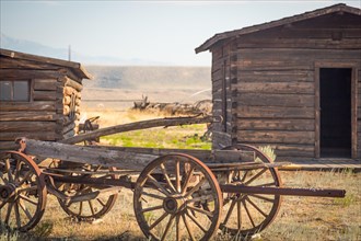 Abstract of vintage antique wood wagon and log cabins