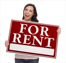 Happy mixed-race female holding for rent sign isolated on white